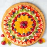 Fruit Pizza topped with strawberries, blueberries, kiwi, mandarin oranges, raspberry