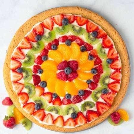 Fruit Pizza topped with strawberries, blueberries, kiwi, mandarin oranges, raspberry