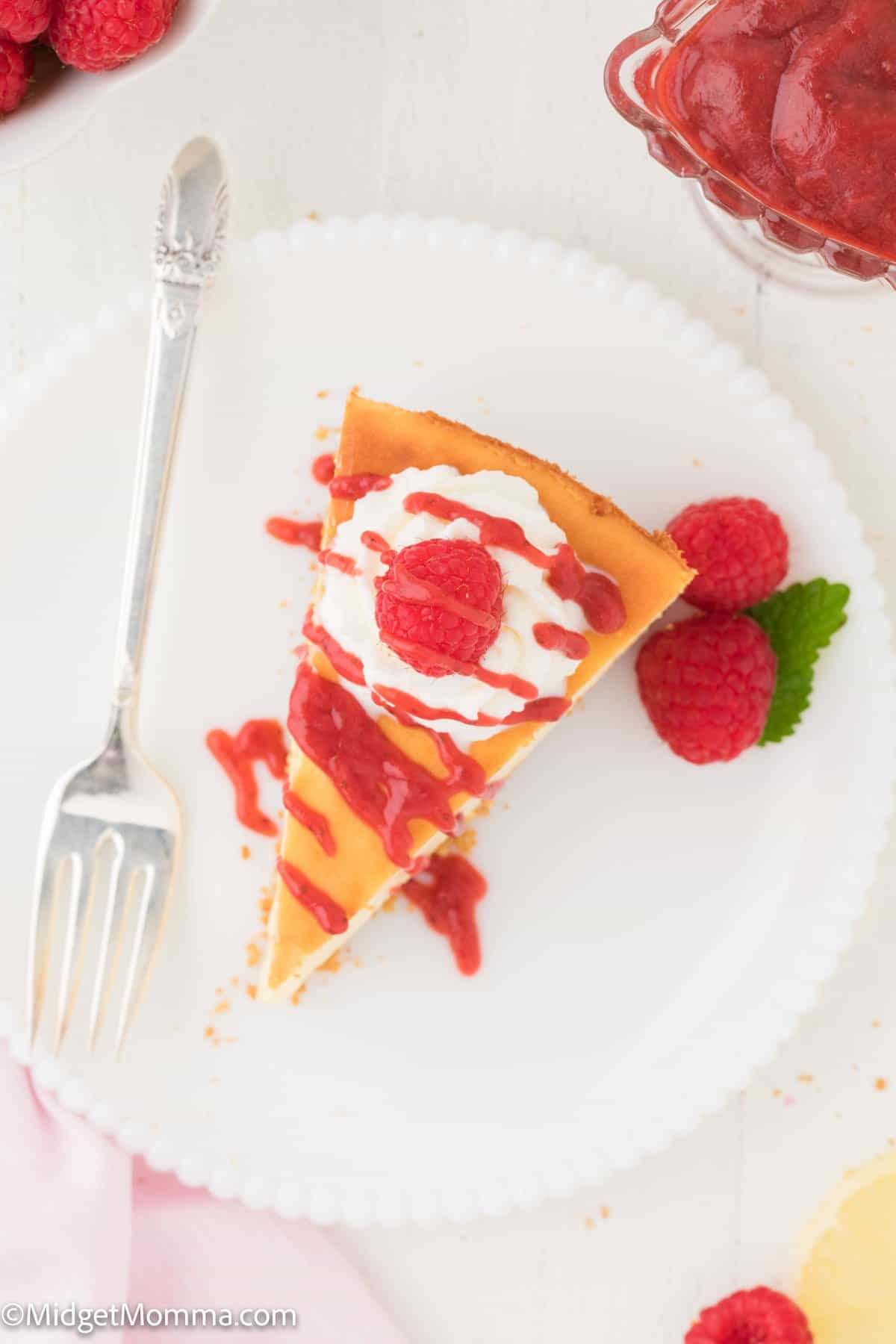 New York Cheesecake Recipe with raspberries and whipped cream