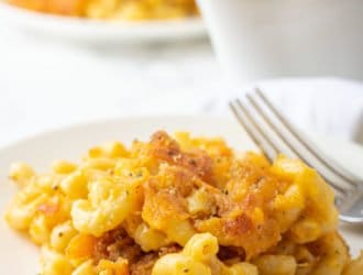 The Best Mac and Cheese on a plate being served for dinner