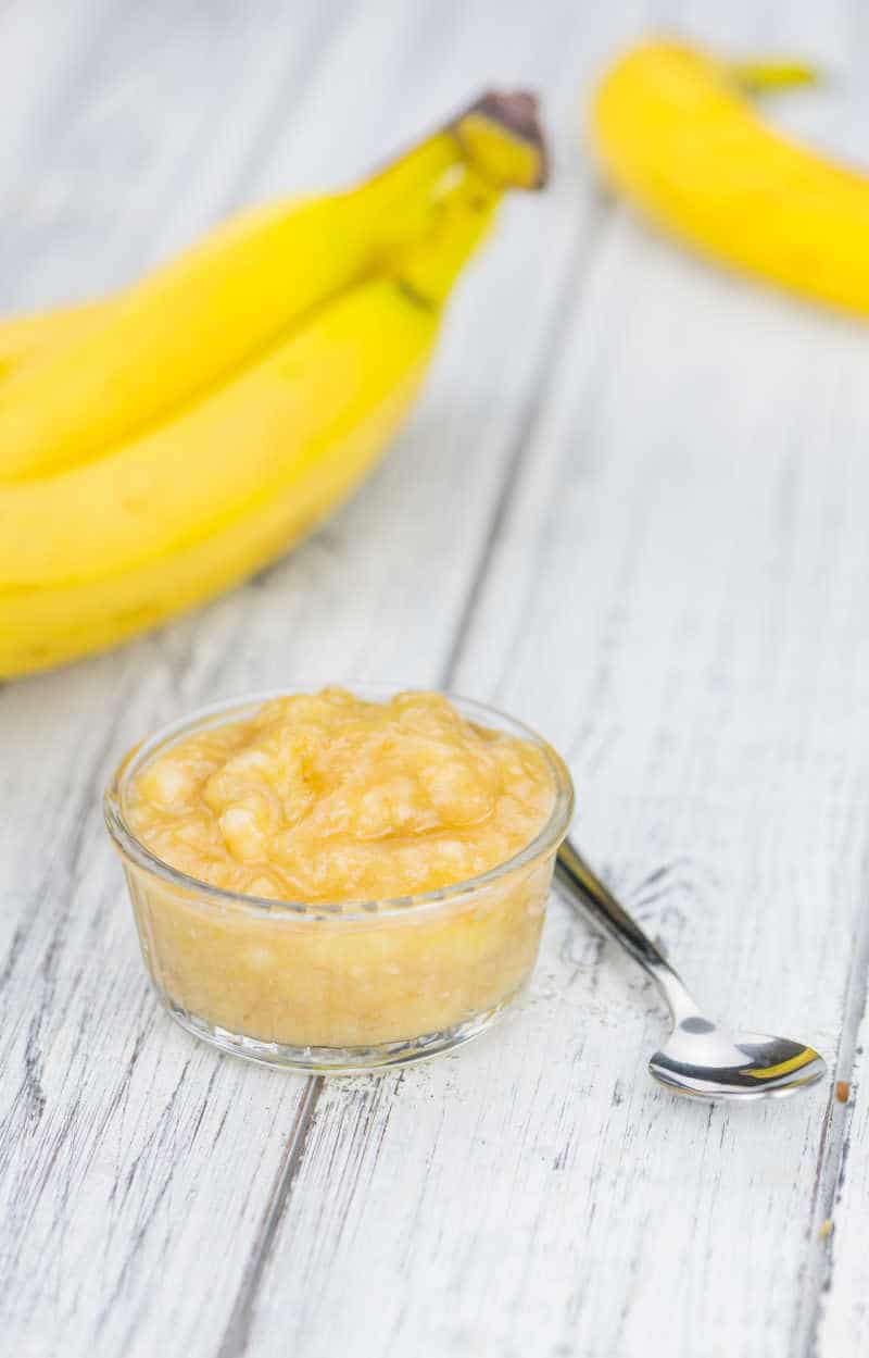 Banana Mash (close-up shot) on a vintage wooden table (selective focus)