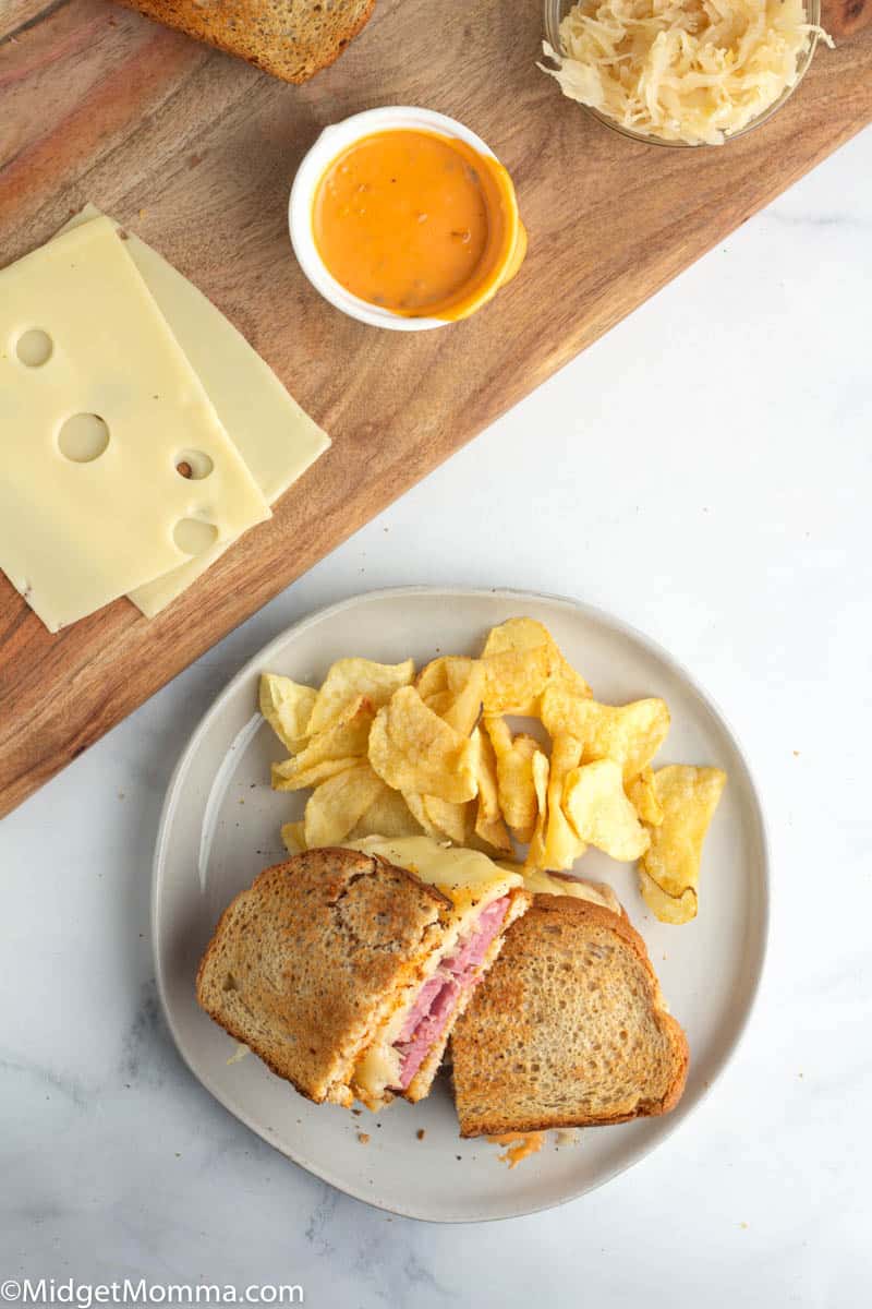 Reuben Sandwich on a plate with chips