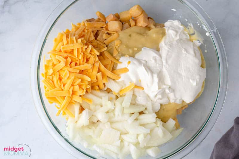 funeral potato ingredients in a mixing bowl