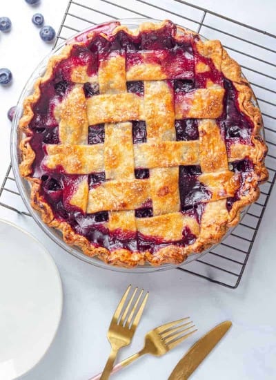 Making blueberry pie from scratch is much easier then you might think! This homemade blueberry pie is bursting with fresh juicy blueberries and tastes amazing alone or with some vanilla ice cream on top.