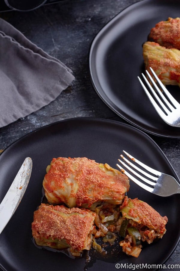 Crock pot stuffed cabbage rolls recipe cooked set on a black plate