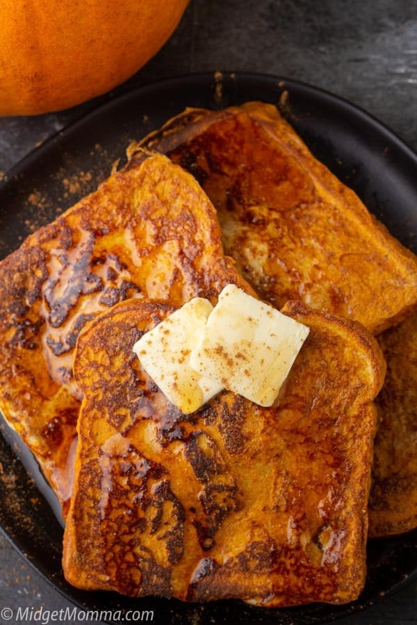 Pumpkin French Toast being drizzeled with maple syrup