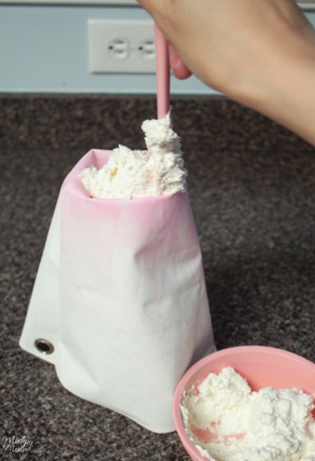 pastry bag being filled with frosting