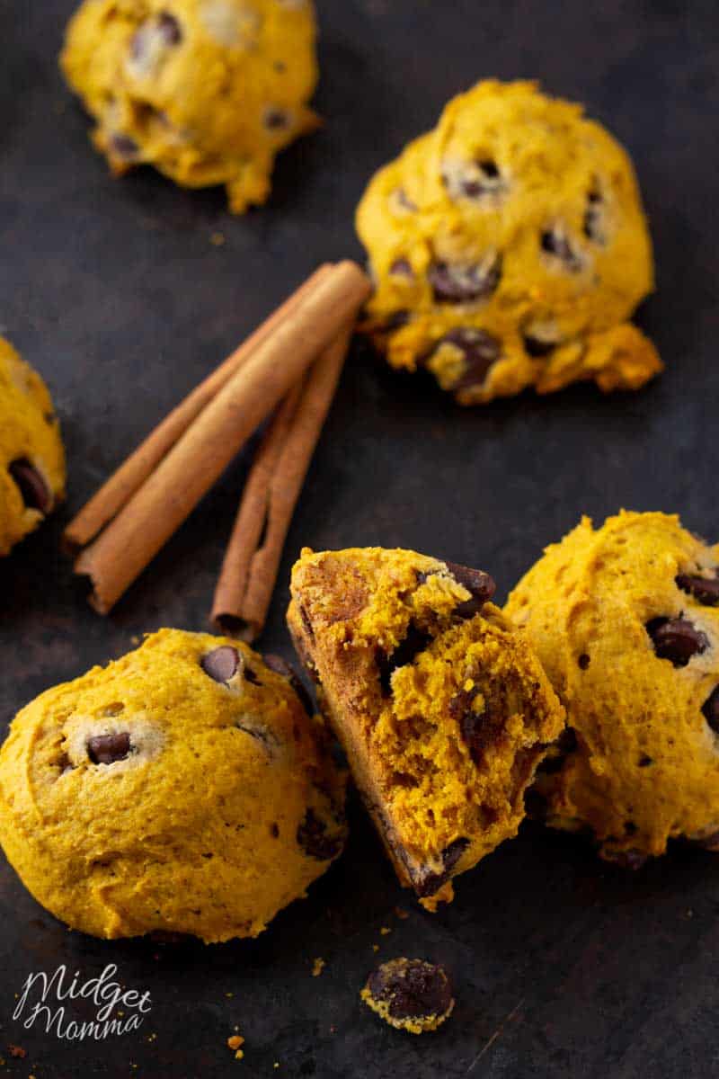 Baking sheet with pumpkin chocolate chip cookies and cinnamon sticks