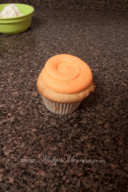 candy corn cupcake with the orange swirl of frosting to start the candy corn 