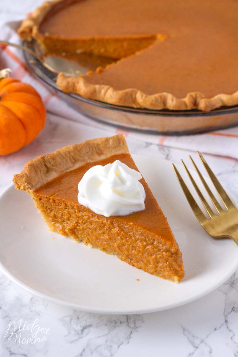 pumpkin pie made with fresh pumpkin topped with a dolup of whipped cream