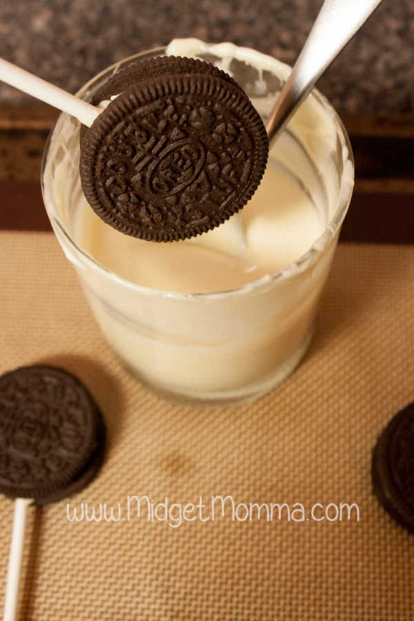 Valentine's Day Oreo cookies being dipped in chocolate