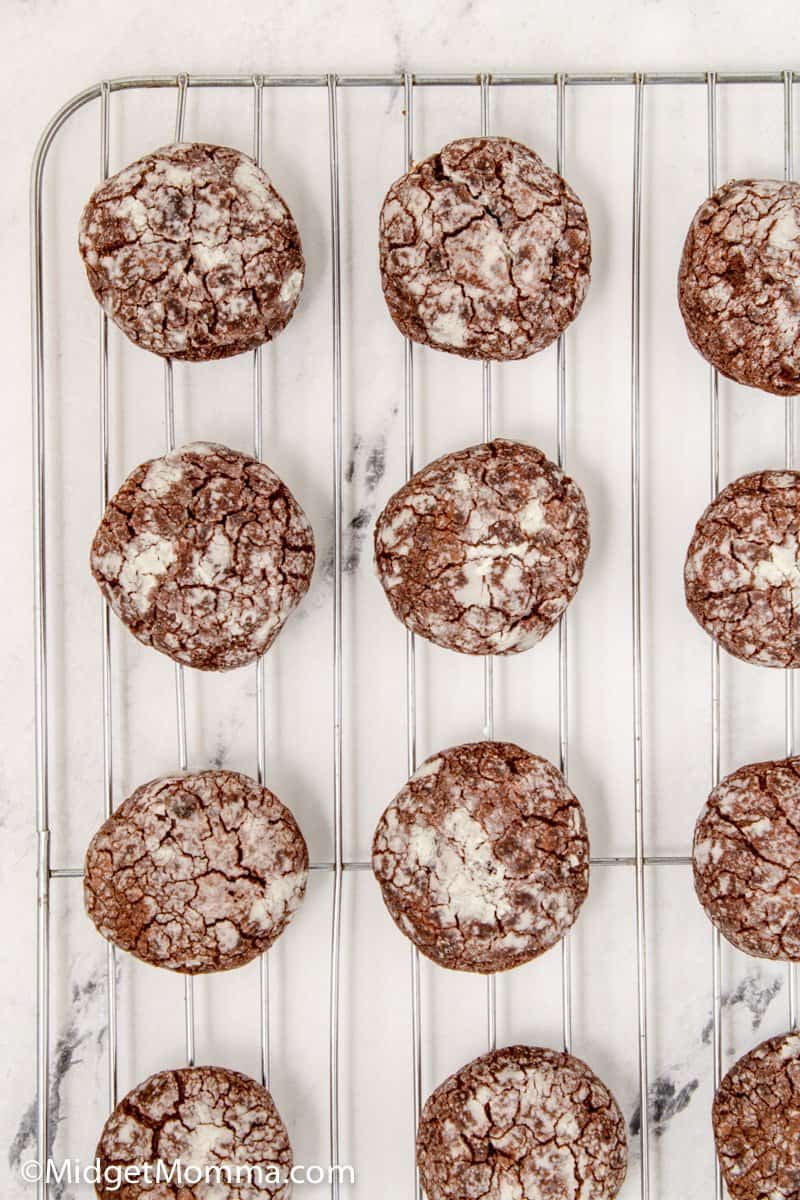 Chocolate Crackle Cookies cooling on a baking rack