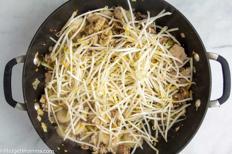 asian lettuce wrap mixture cooking in a skillet