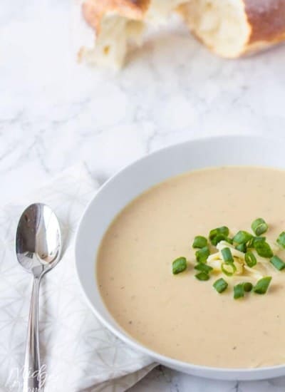 bowl of cauliflower and cheese soup made in the crockpot