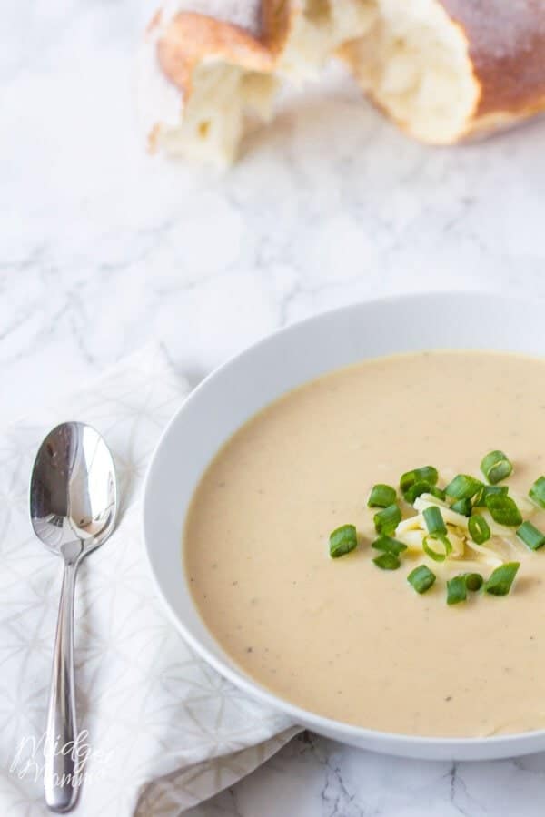 bowl of cauliflower and cheese soup made in the crockpot