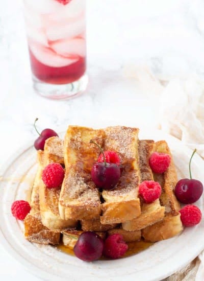 This easy homemade french toast stick recipe is the perfect breakfast. Once you make these Cinnamon and Sugar Homemade French Toast Sticks you will never want to eat frozen french toast sticks again! I have been told these easy french toast sticks taste just like cinnamon and sugar doughnuts!