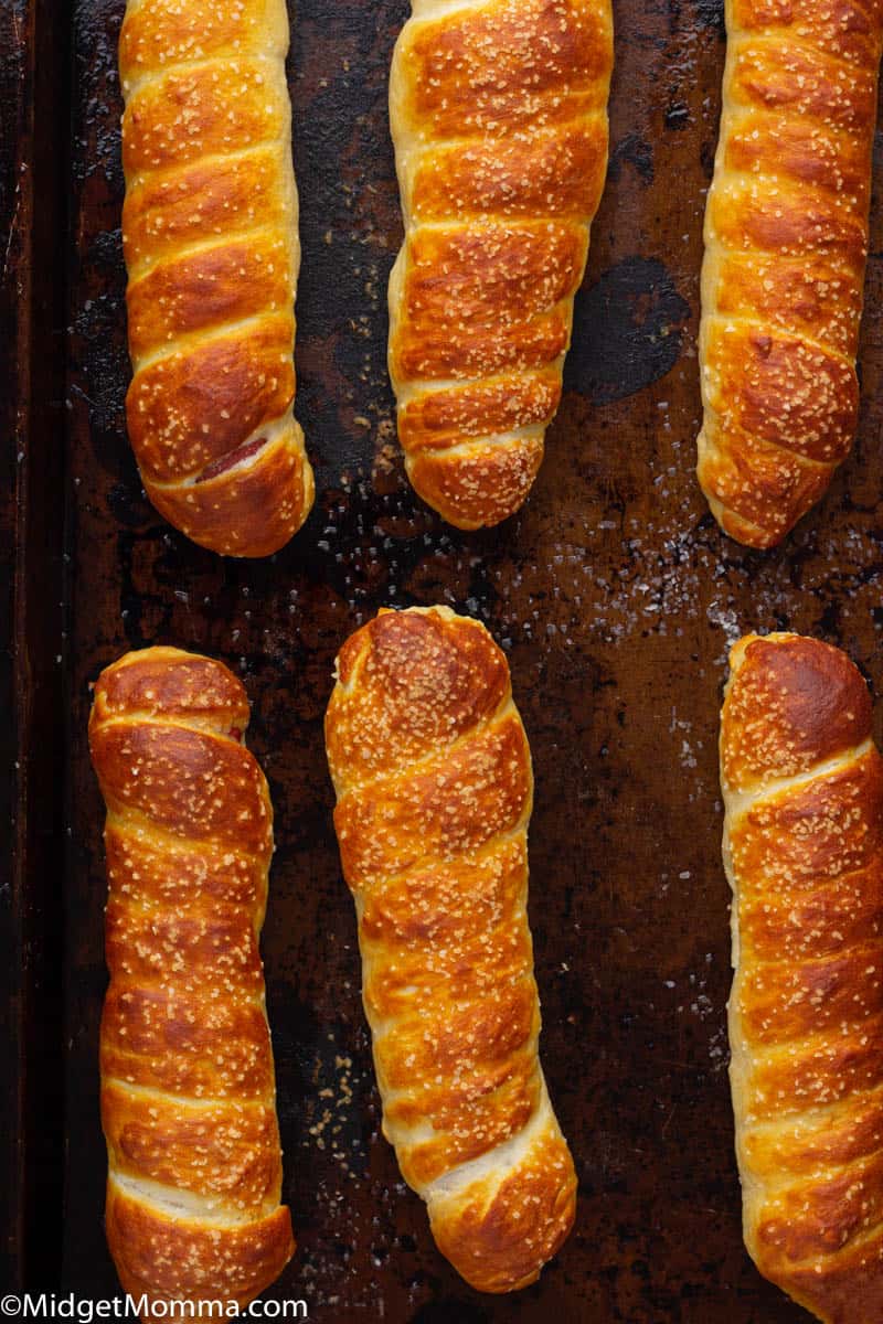 pretzel dogs on a baking sheet out of the oven