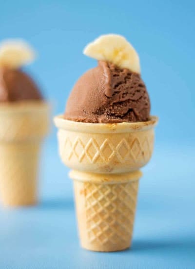 Banana Ice Cream with chocolate and peanut butter served in an ice cream cone