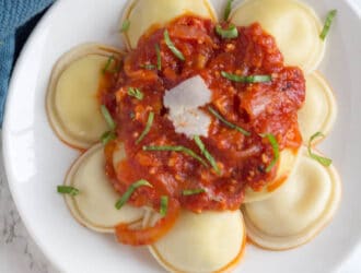 Raviolis with bacon Arrabiata sauce on a plate