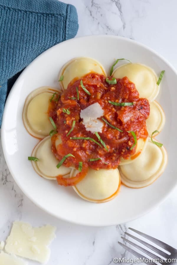 Raviolis with bacon Arrabiata sauce on a plate