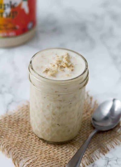 homemade overnight oats in a mason jar with maple syrup