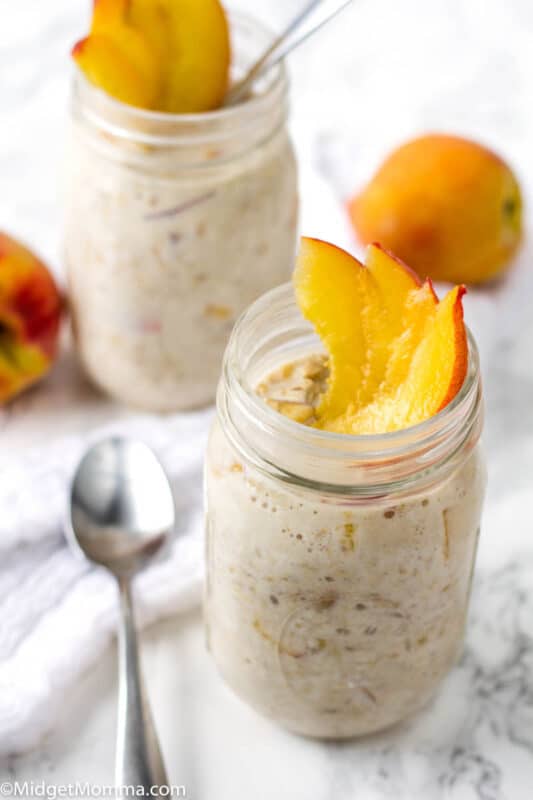 Easy overnight oats with peaches in a mason jar with a spoon