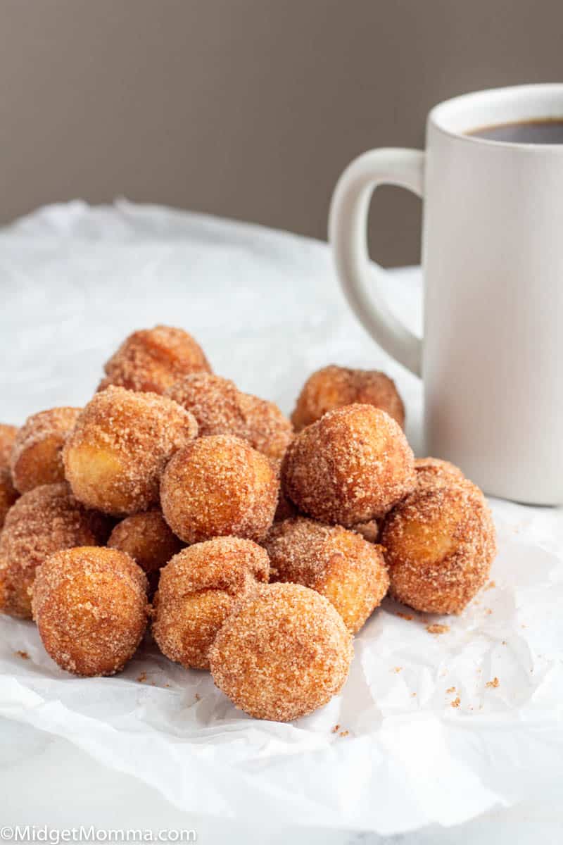Cinnamon Sugar Donuts on a plate with a cup of coffee