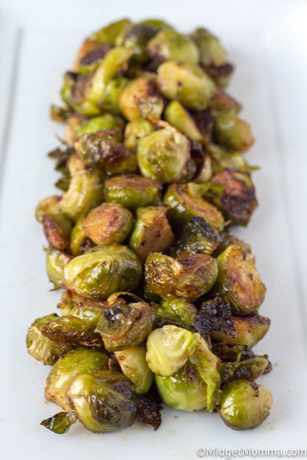 Oven Roasted Brussel Sprouts on a white serving dish