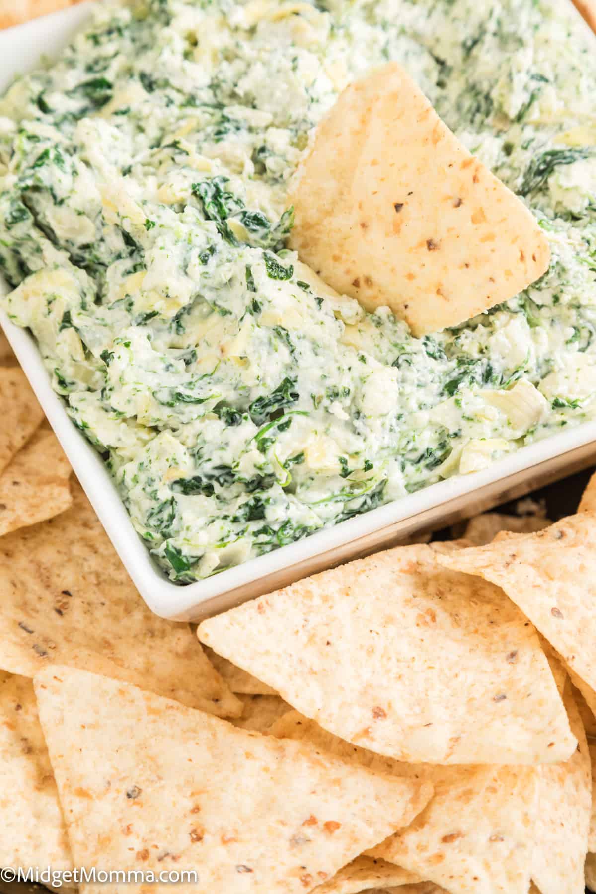 serving dish filled with Cold Spinach Artichoke dip