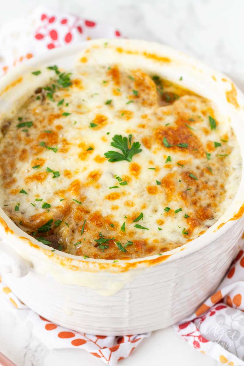 Homemade french onion soup with melted cheese in a ramkin