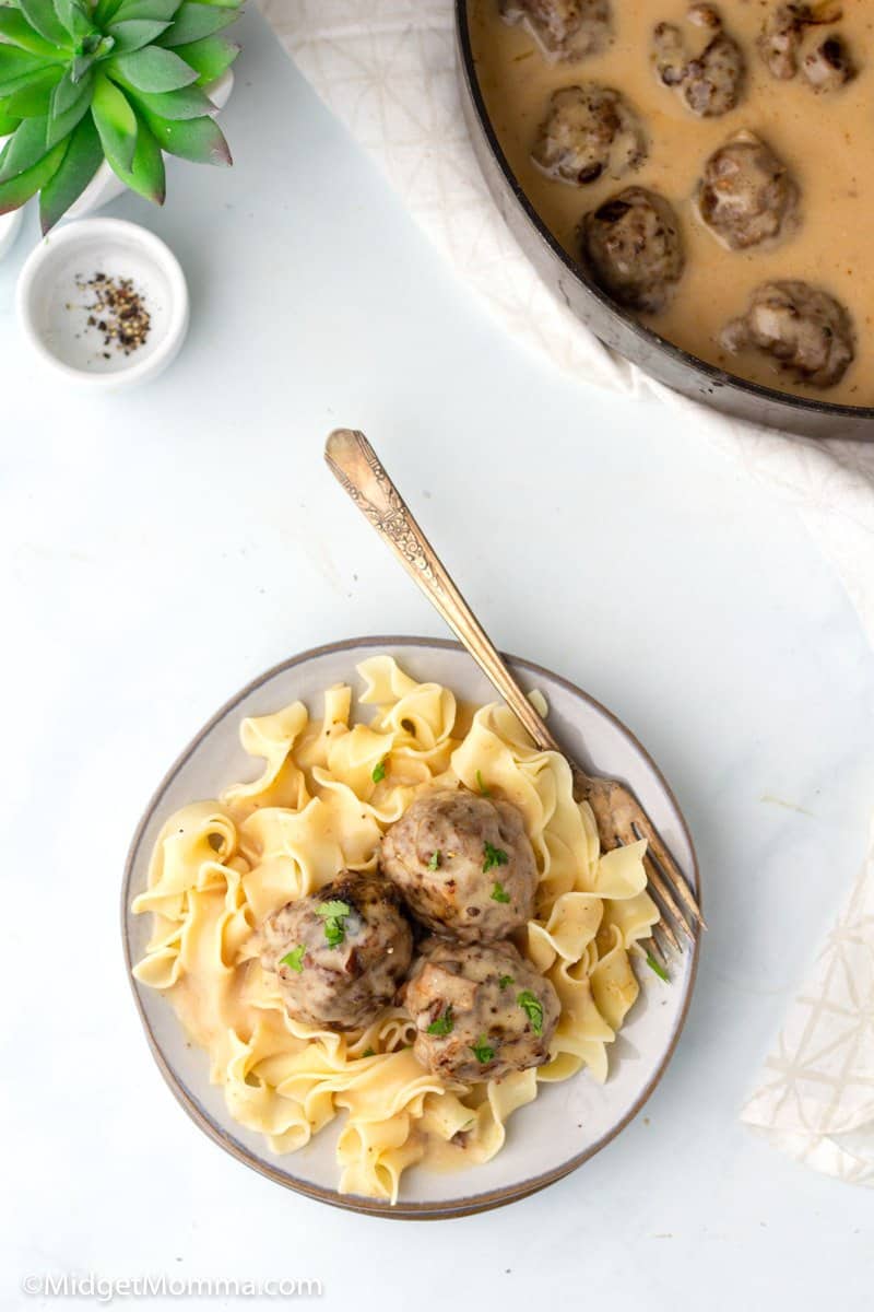 Swedish Meatballs on a plate over egg noodles