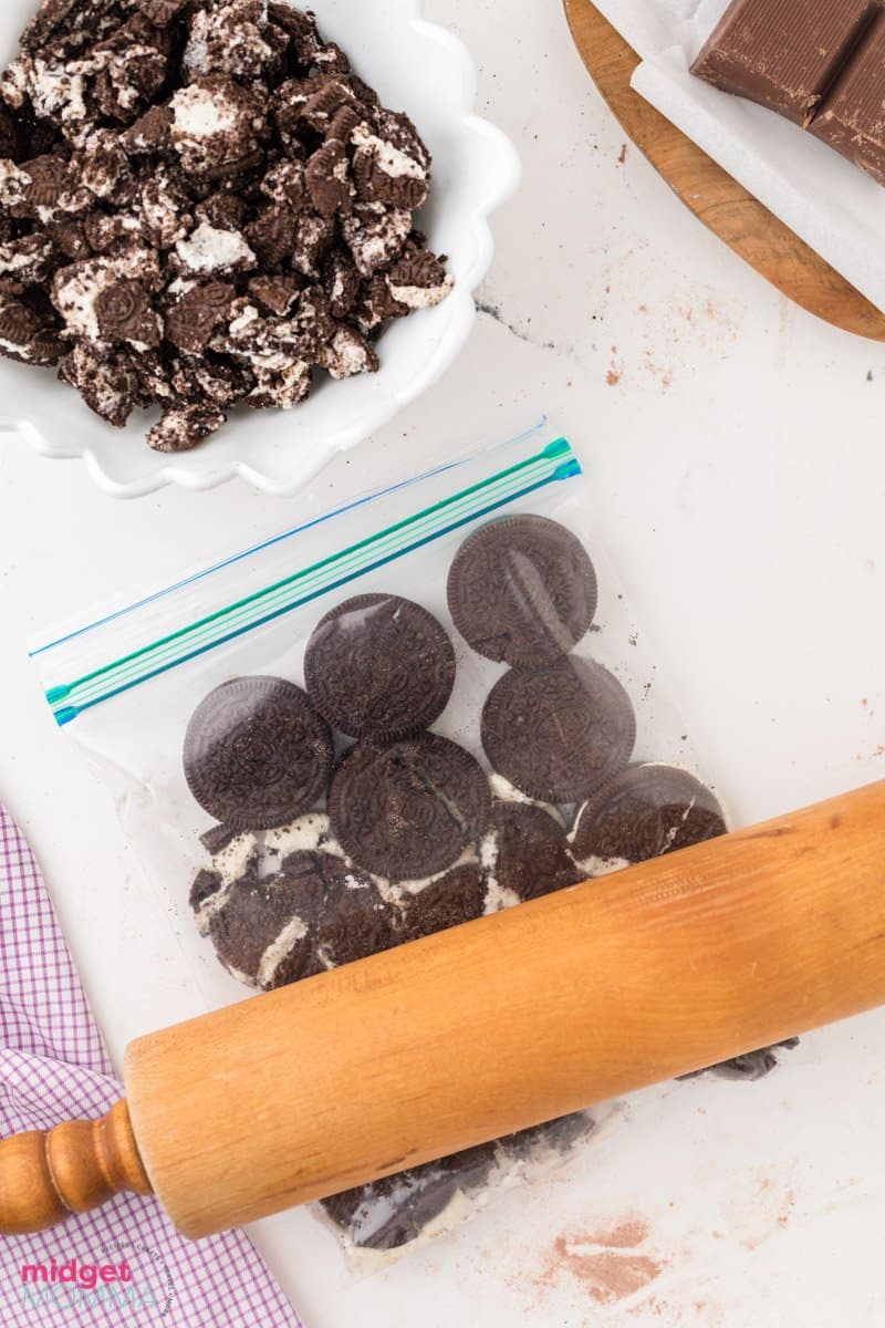 Oreo Cookies being crush in a zip close bag with a rolling pin