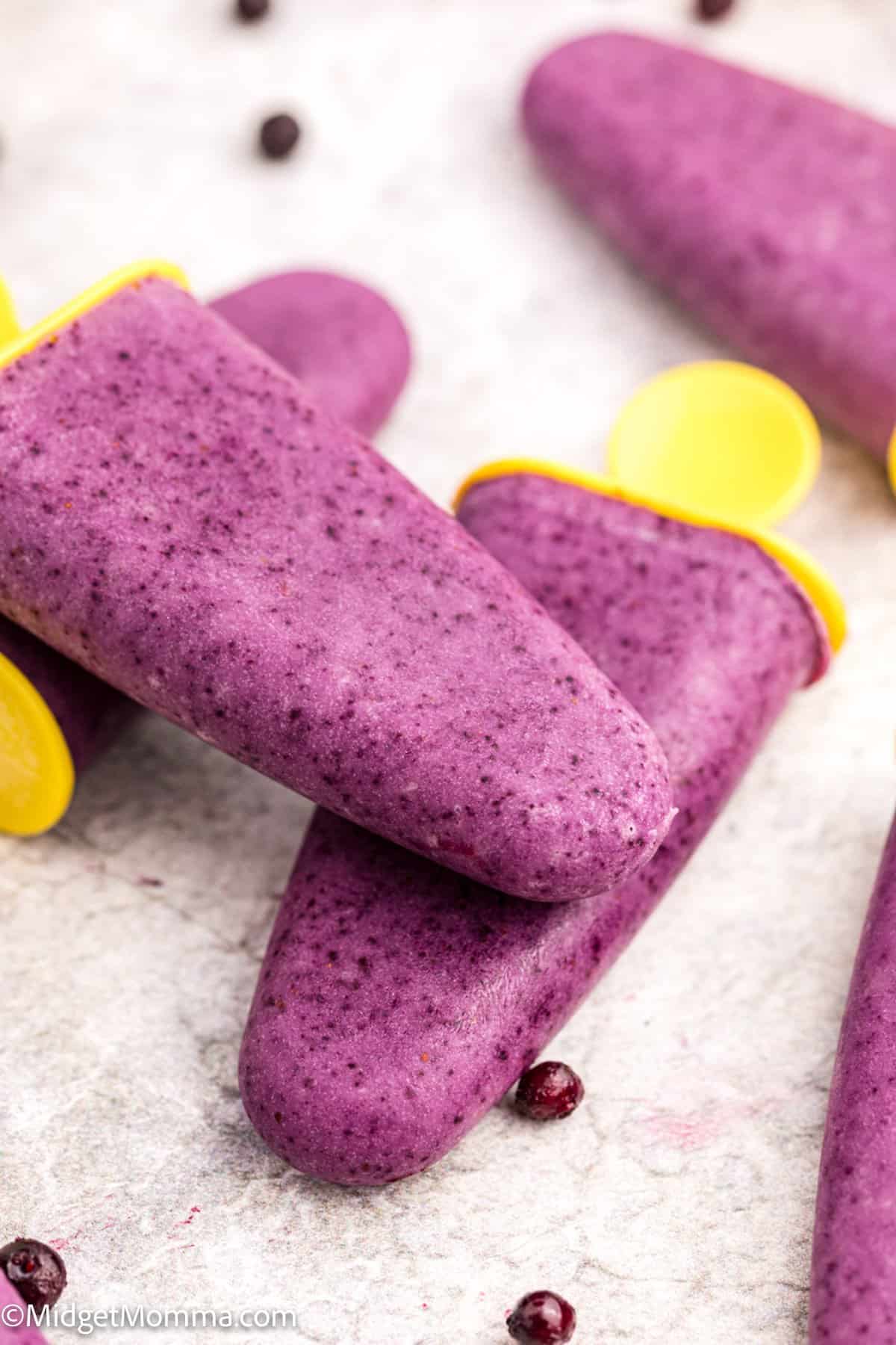close up photo of yogurt popsicles made with blueberries