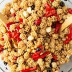 Balsamic roasted red pepper pasta salad in a glass bowl