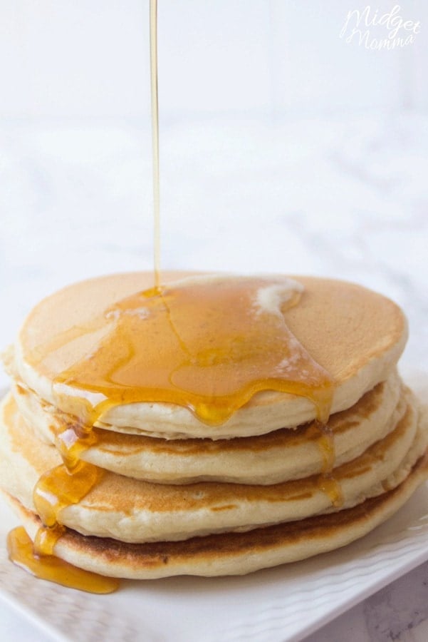 homemade pancake mix cooked in a stack of 3 homemade pancakes drizzled with maple syrup