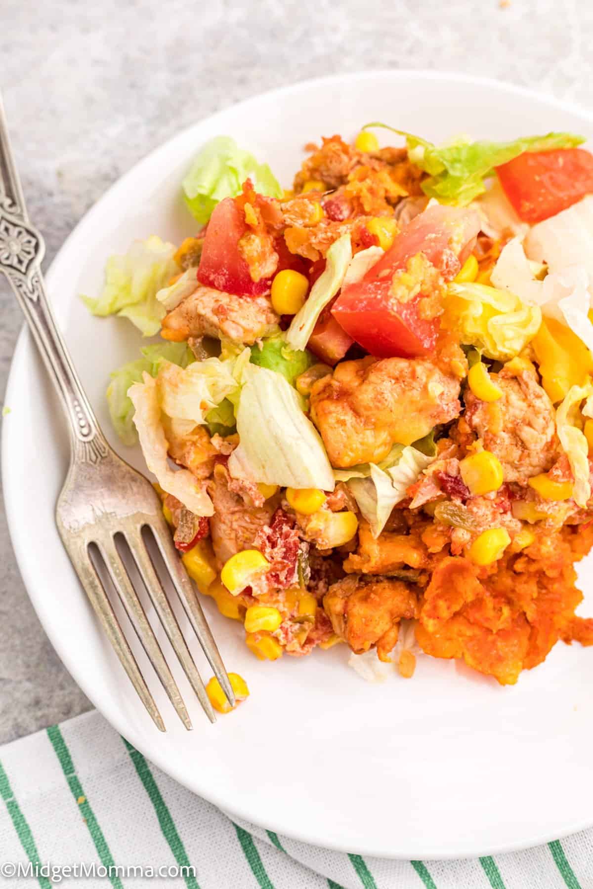 Cheesy Doritos Chicken Casserole serving on a white plate