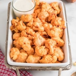 large serving dish with Oven Baked Spicy Buffalo Cauliflower Bites