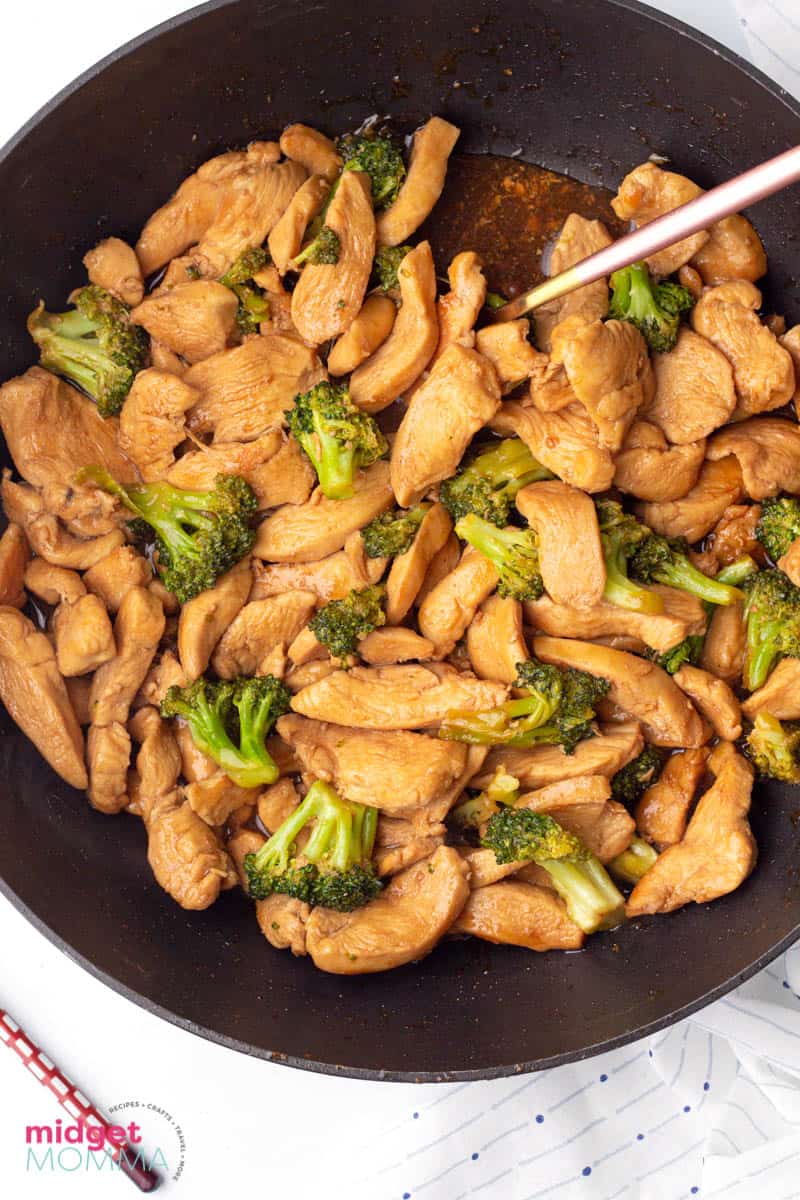 chicken and broccoli stir fry in a pan