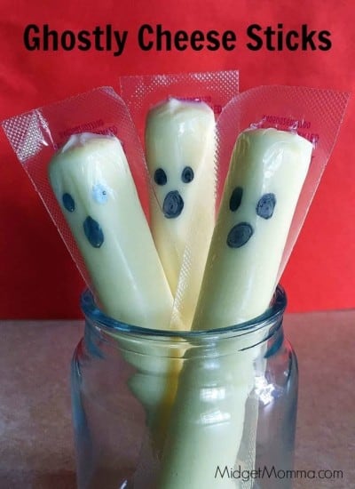 Ghost Cheese Sticks. Super easy Halloween snack treat that kids will find fun and mom can do in less then 20 seconds!