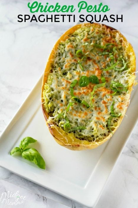 This Chicken Pesto Spaghetti Squash is an oven baked spaghetti squash recipe that is bursting with flavor. Chicken and Pesto combine for a flavorful spaghetti squash recipe that everyone will enjoy. #Chicken #SpaghettiSquash #Pesto #BakedSpaghettiSquash #Dinner #SpaghettiSquashRecipe #ChickenSpaghettiSquash