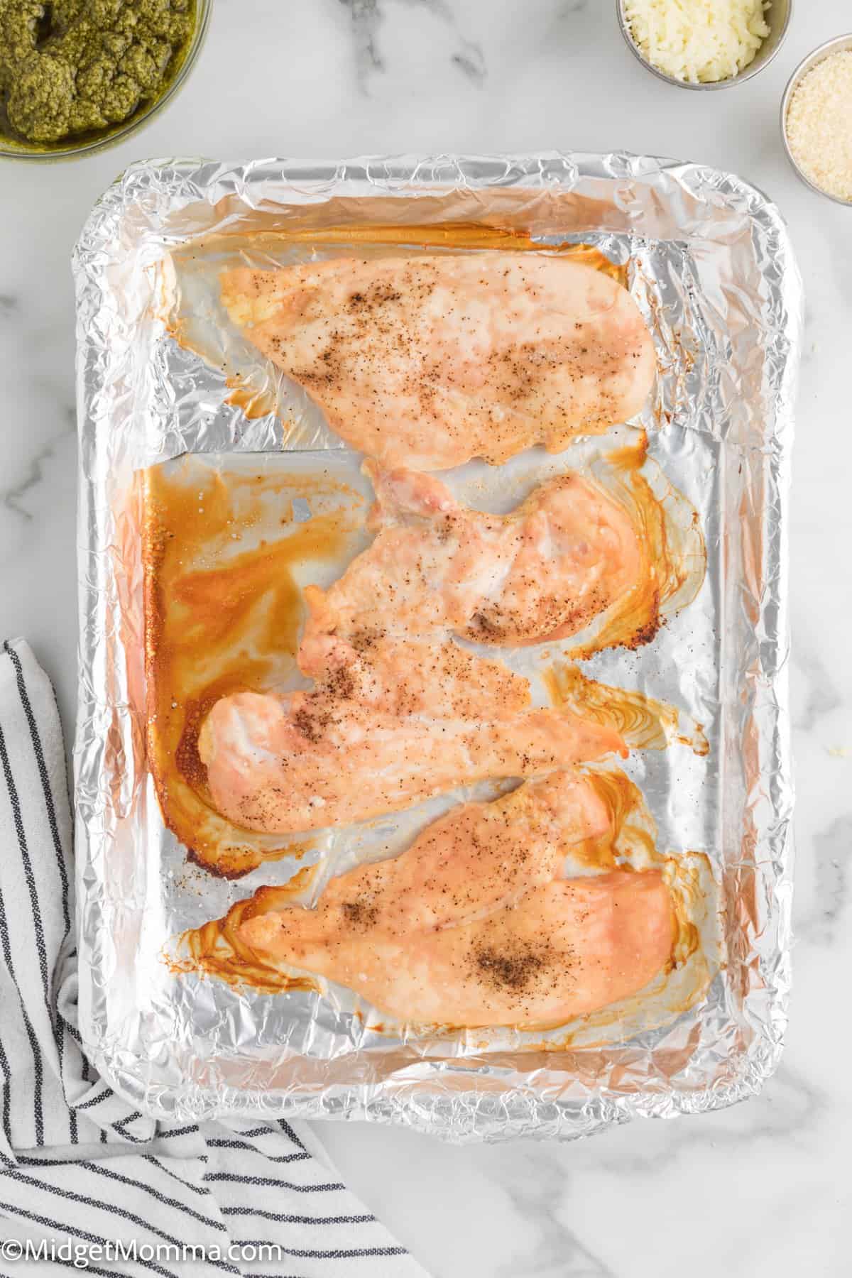 cooked chicken on a baking sheet