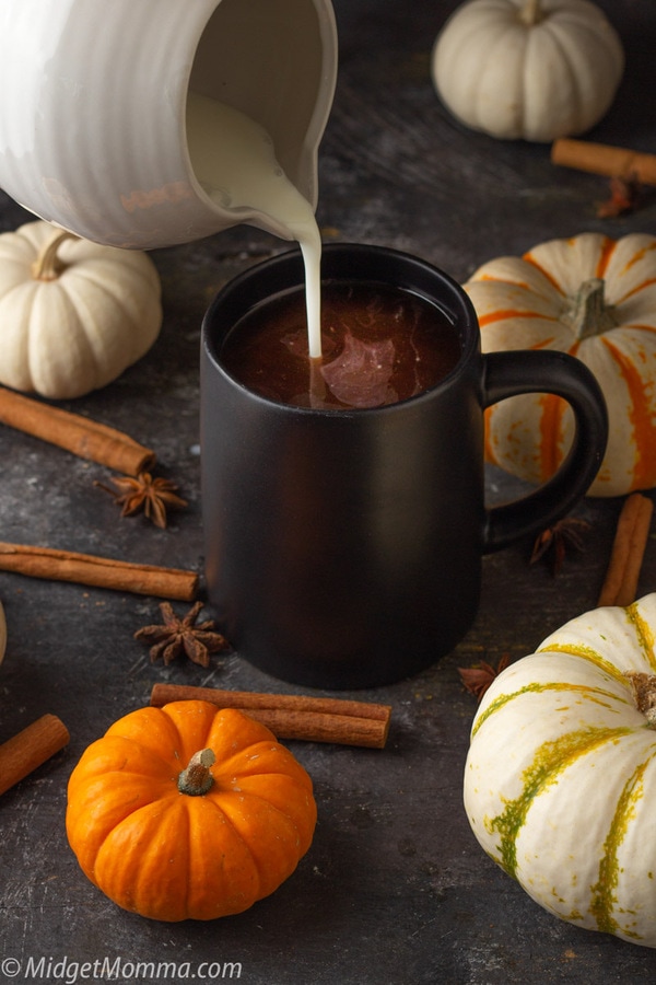 Creamer being added to a cup of Pumpkin Spice Coffee