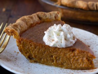 slice of pumpkin pie made with maple syrup on a plate