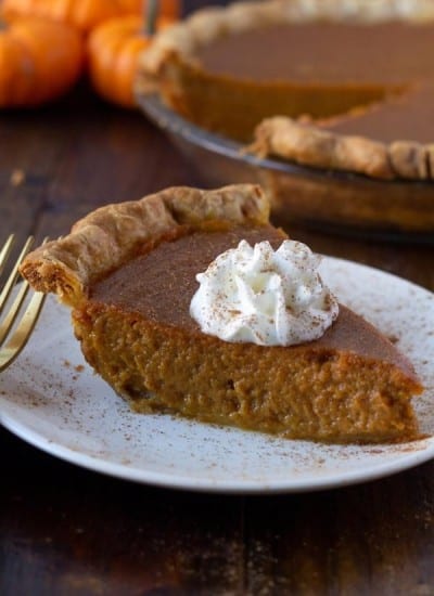 slice of pumpkin pie made with maple syrup on a plate