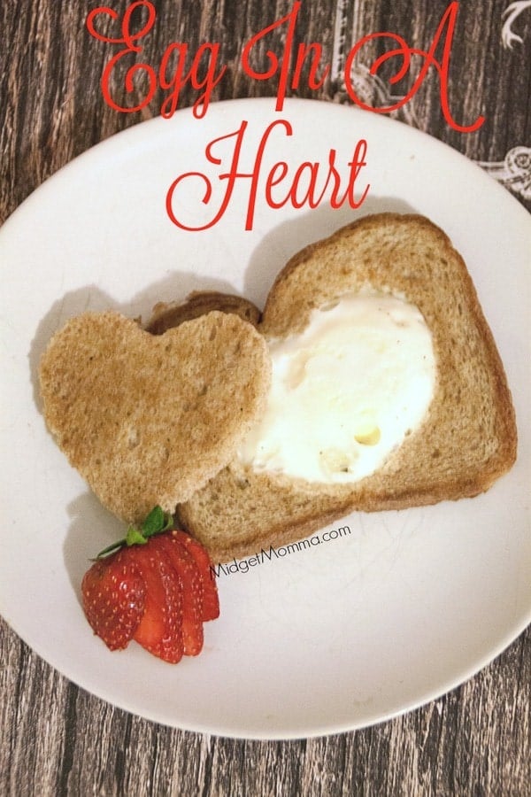 Egg In A Heart. A fun twist on your traditional egg in a hole, but so much more fun because it has a heart. A fun one for Valentine's Day or just because.