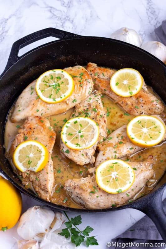 Lemon Garlic Chicken Recipe cooked in a black skillet on the counter