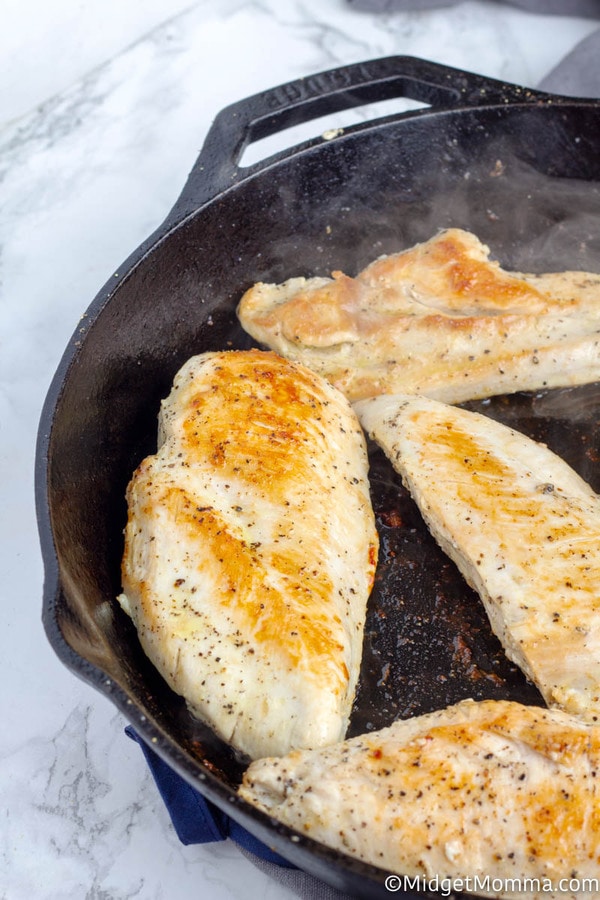 Chicken breasts cooking in skillet