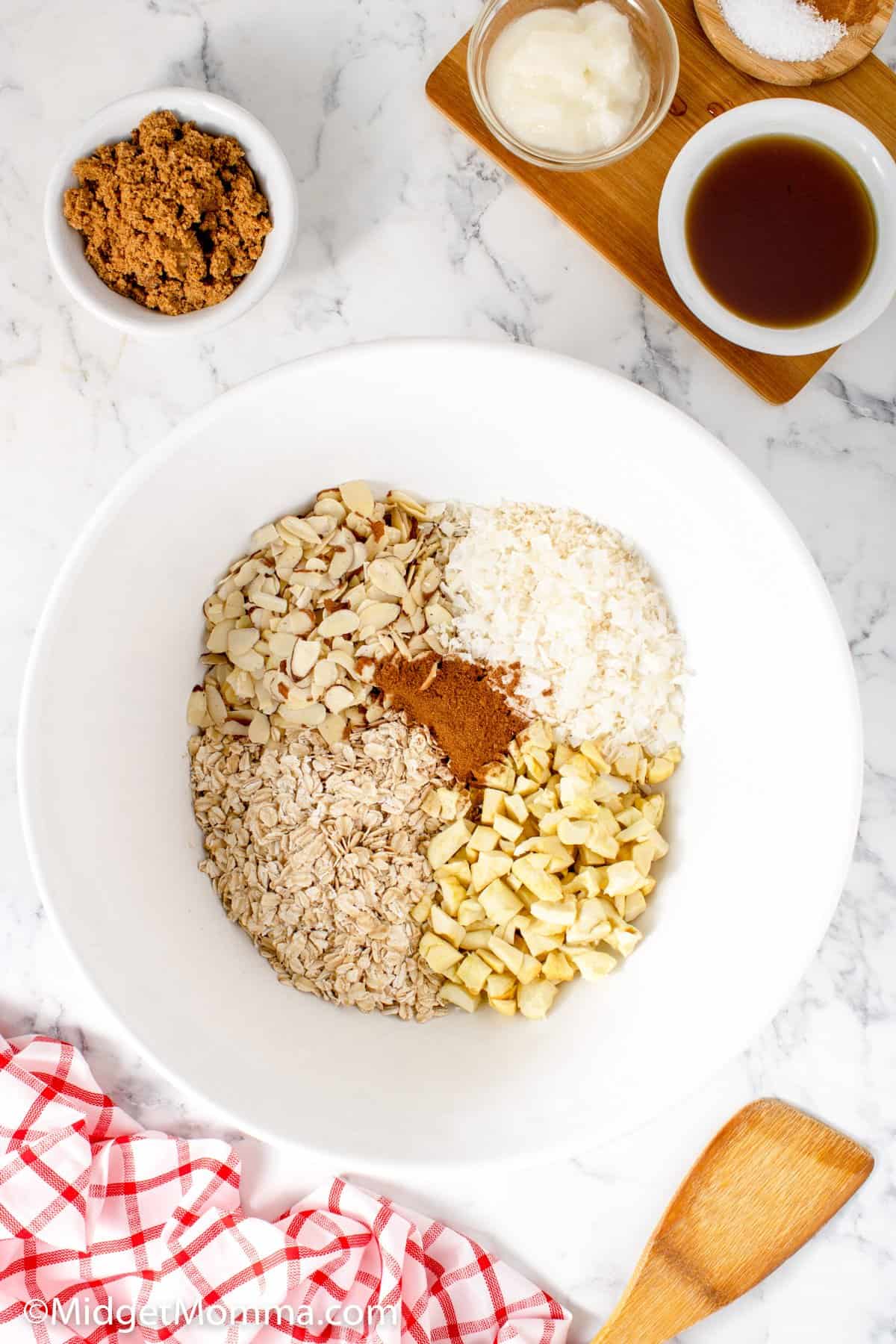 Cinnamon apple granola ingredients in a bowl