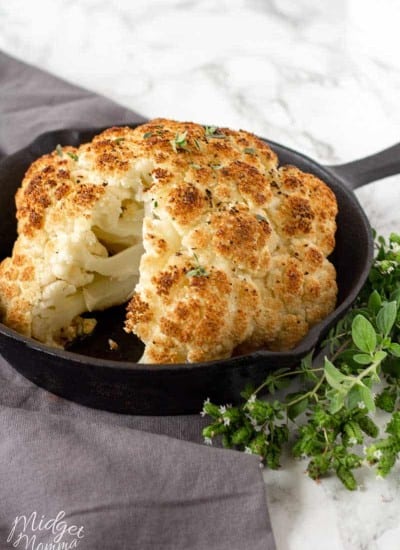 Whole roasted cauliflower in a baking pan