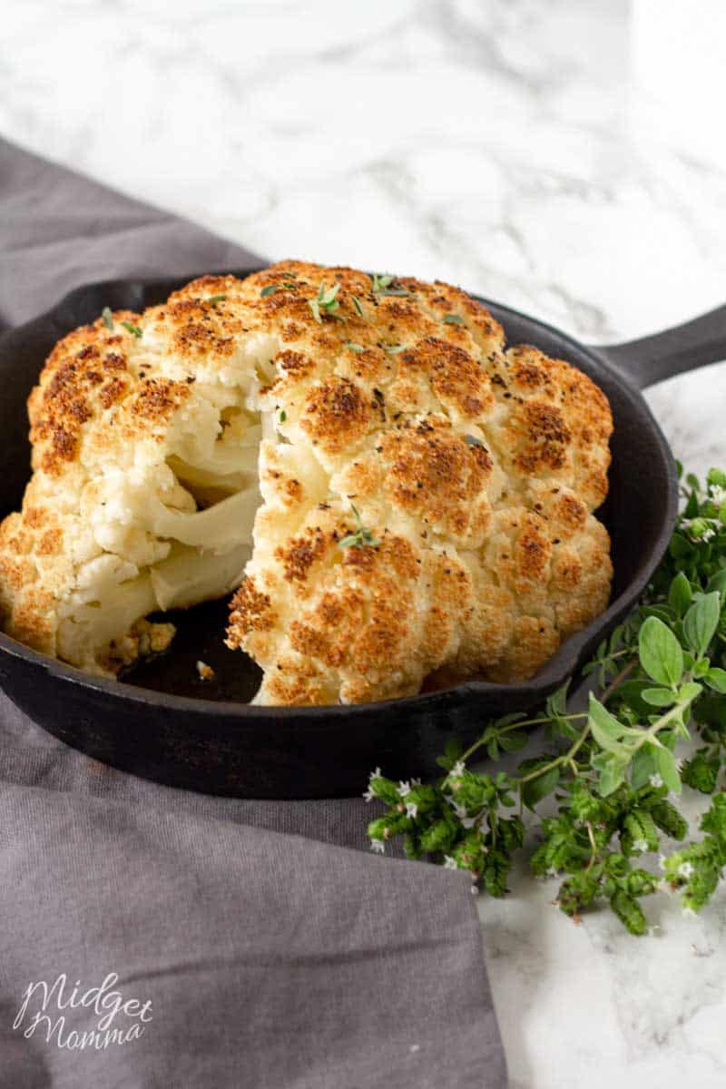 Whole roasted cauliflower in a baking pan